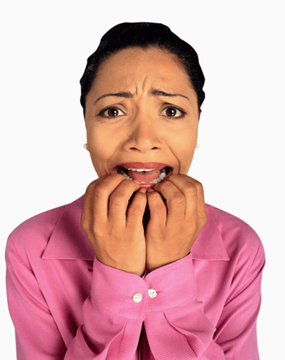 woman biting nails with anxiety